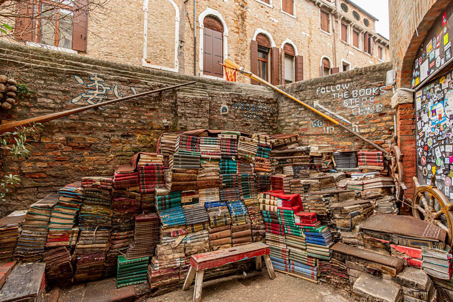 huge pile of books forming steps you can walk on at a book shop