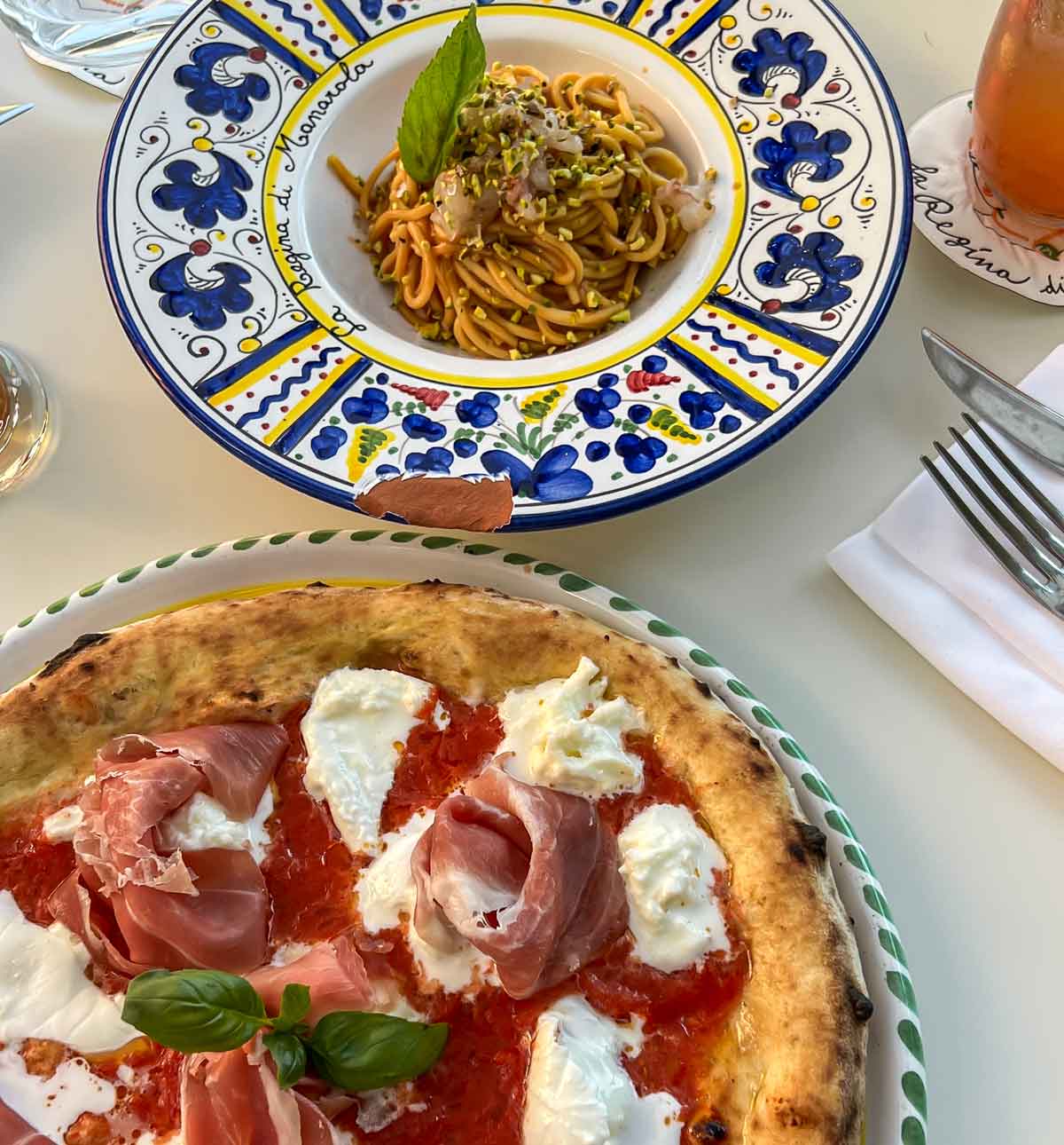 Tagliolini pasta dish and pizza with ham and cheese