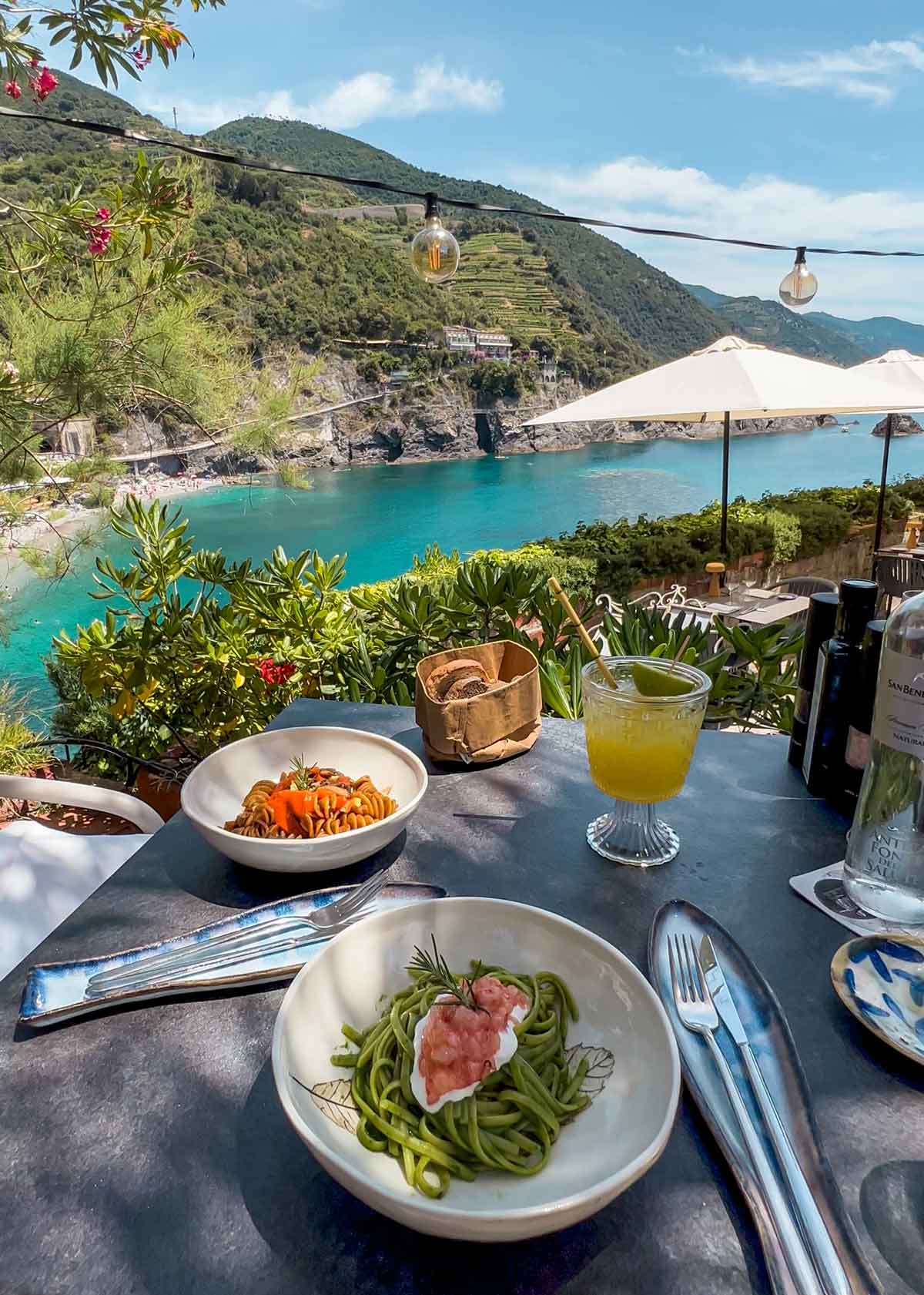 pasta dish with view of beautiful terraced restaurant with view of Mediterranean sea