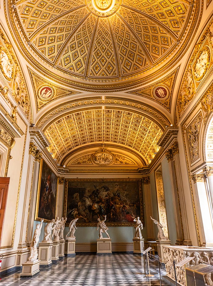 ornate room in art gallery with detailed ceiling