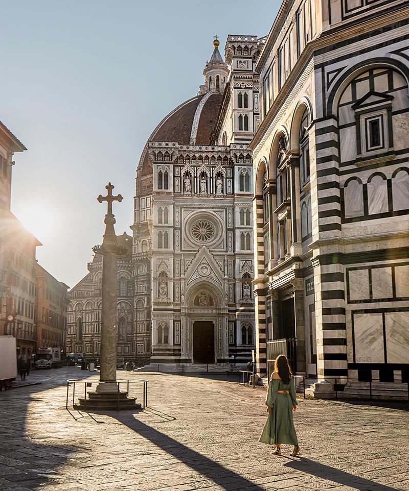Woman walking past the florence cathedral